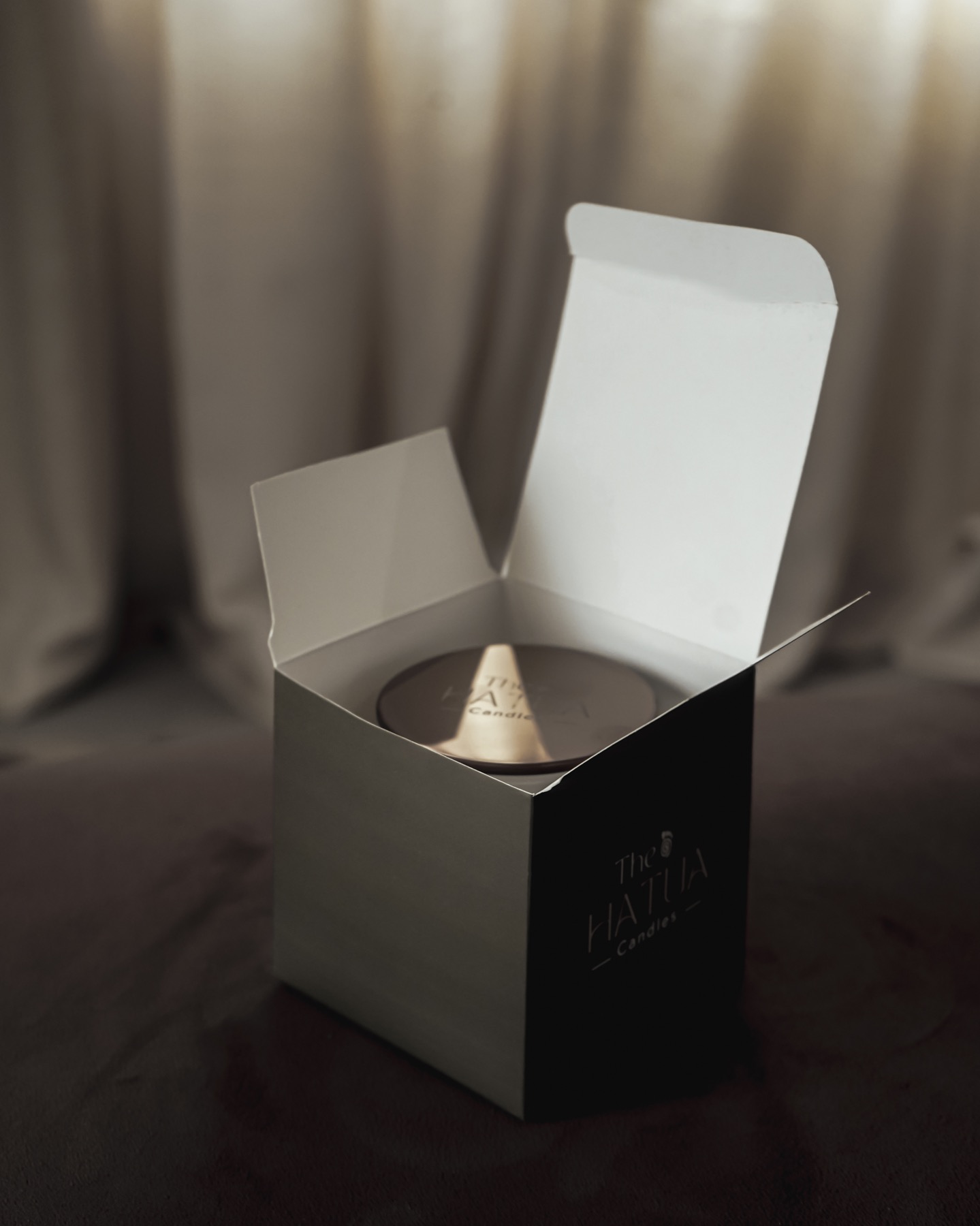 A Hatua Candles box being opened