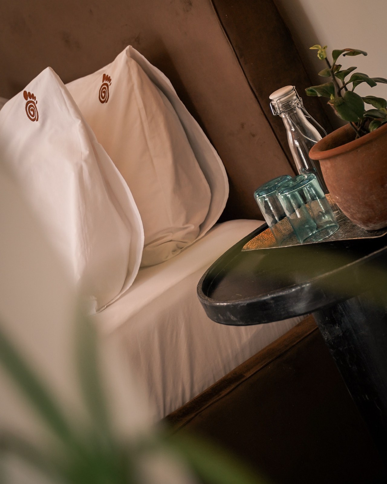 Bed linen detail with the Hatua mark